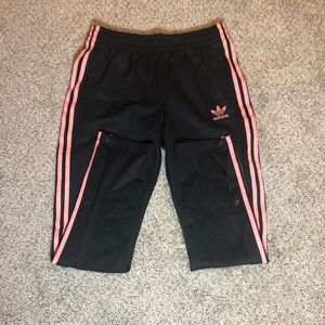 Adidas black and pink striped snap track pants
